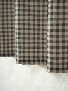Close-up of grey and white plaid cotton linen fabric with fine texture for cafe curtains