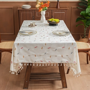 Rectangular cream tablecloth with colorful candy embroidery and elegant fringe edges
