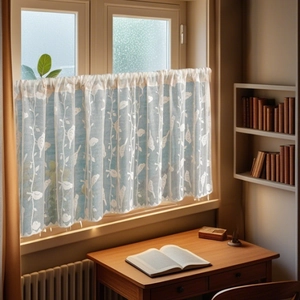 Close-up of light blue lace cafe curtain with jacquard bird pattern and wavy hem