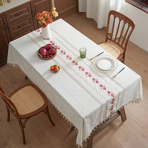 Waterproof cream tablecloth with geometric red embroidery and decorative white tassels