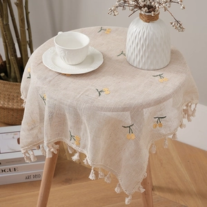 Linen table runner with yellow cherry embroidery and tassel fringe for home decor