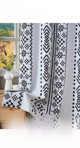 Detail view of black and white geometric blackout curtains with premium smooth fabric texture