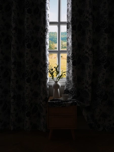 Detail of Nordic blackout curtains with elegant black and white floral and butterfly prints