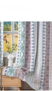 Detail of Nordic geometric blackout curtain with thick green and brown printed fabric
