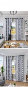 Detail of bohemian geometric pattern blackout curtain with metal eyelets and fabric texture