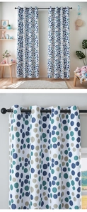 Detail of Nordic blackout curtain with colorful dots and black metal grommet rings
