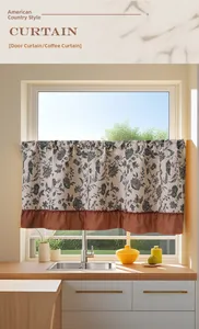 Detail of floral American country cafe curtain with ruffles on a kitchen window