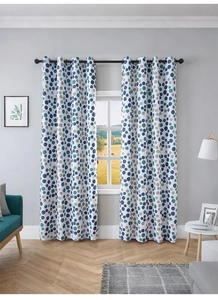 Close-up of modern Nordic blackout curtains with blue and khaki polka dot patterns