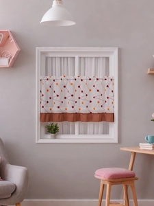 Detail of cafe curtain with geometric polka dots and brown pleated lace decoration