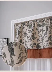 Detail of floral American vintage half curtain with ruffled edges and fine linen texture