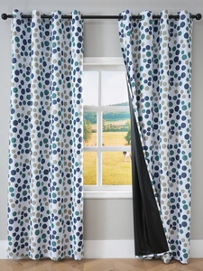 Detail of Nordic blackout curtain showing colorful polka dots and black light-blocking lining