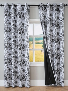 Detail of floral blackout curtain showing grommet top and black shading liner