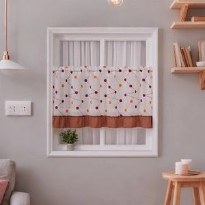 Pastel cafe curtain with dot patterns and coffee-colored ruffled trim on a small window