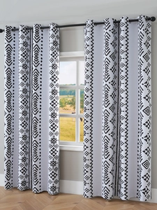 Detail of Nordic blackout curtain featuring black and white geometric totem prints