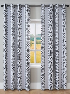 Detail of bohemian geometric print blackout curtains with black metal grommet top