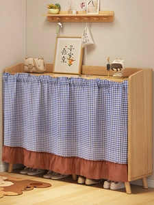 Detail of blue plaid cabinet curtain with coffee brown ruffled trim and durable cotton linen fabric