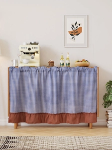 Blue and white plaid cabinet curtain with decorative brown ruffled edge detail