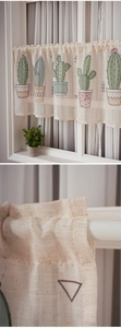 Detail of linen coffee curtain with cactus print and pleated rod pocket heading