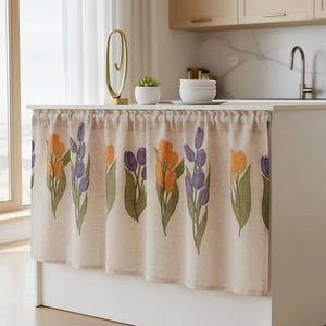 Linen kitchen cabinet curtain with orange and purple tulip print in a bright modern home