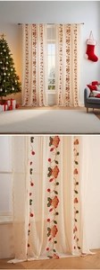 Detail of Christmas sheer curtains with bell embroidery and wave lace borders
