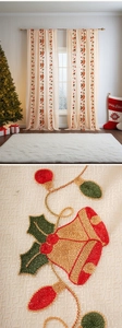 Close-up of festive Christmas bell embroidery on cream-colored linen window sheer curtains