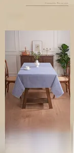 Blue and white checkered tablecloth close-up showing fabric texture and soft drape