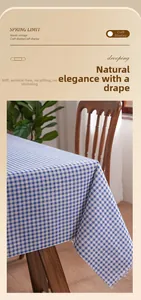 Detail of blue checkered table cloth with frayed edges on a wooden table setup