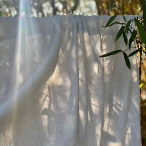 Japanese linen door curtain in white semi-transparent fabric with natural textures