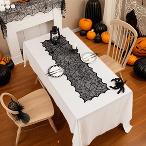 Elegant black lace spiderweb table runner for spooky Halloween party table decorations