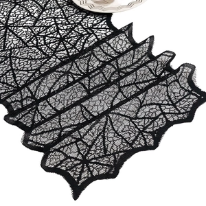 Black lace spider web table runner for Halloween party decor and spooky table setting