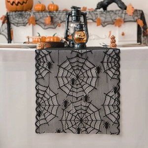 Elegant black lace Halloween table runner with spider web patterns and wavy edges