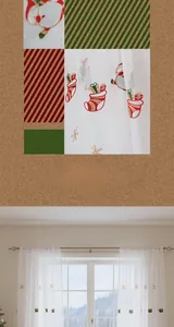 Detail of Christmas sheer curtain with Santa and snowflake embroidery for festive home decor