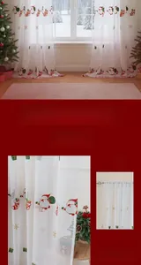Detail of Christmas sheer curtain with festive Santa, stockings and snowflake embroidery