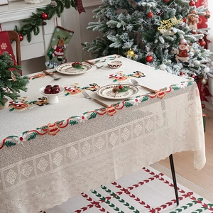 Christmas tablecloth with embroidered Santa and reindeer motifs and lace hollow edges