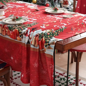 Festive red Christmas tablecloth with Merry Christmas text and seasonal tree patterns