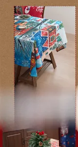 Macro view of festive Christmas tablecloth and chair covers with snowman print