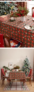 Detail of red and green plaid Christmas tablecloth with snowflake print on cotton fabric