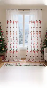 Detail of Christmas sheer curtain with Santa Claus patterns and Navidad text embroidery