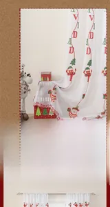 Detailed embroidery of Santa Claus and trees on white lace Christmas window curtain