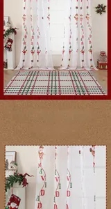 Detailed close-up of embroidered Santa Claus patterns on white translucent window curtains