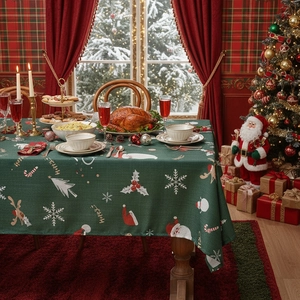 Festive dark green Christmas tablecloth with Santa, reindeer and snowflake prints
