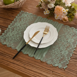American pastoral green lace table runner with floral embroidery and wavy edges on wood