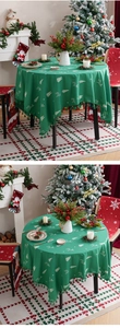 Detail of green Christmas tablecloth with white deer patterns and fringe tassels