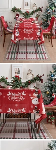 Detail of red Christmas tablecloth with snowman pattern and Merry Christmas text