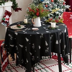Black Christmas round tablecloth with white reindeer, tree patterns and tassel edges