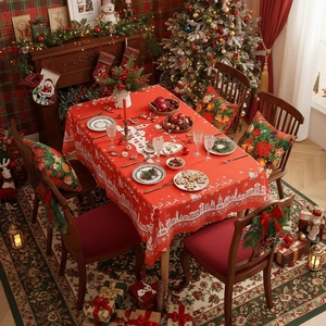 Rectangular red Christmas tablecloth with white village patterns for holiday dining decor
