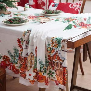 Festive Christmas tablecloth featuring snowy cabins and winter berries pattern on white