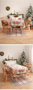 Close-up of Christmas tablecloth featuring poinsettia patterns and holiday chair cushions