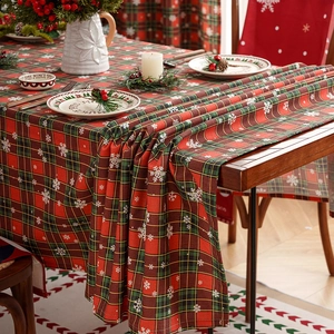 Red and green plaid Christmas tablecloth with snowflake pattern for festive dining decor