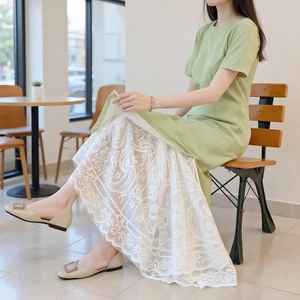 Light green short sleeve dress with white hollow lace skirt and elegant drape finish
